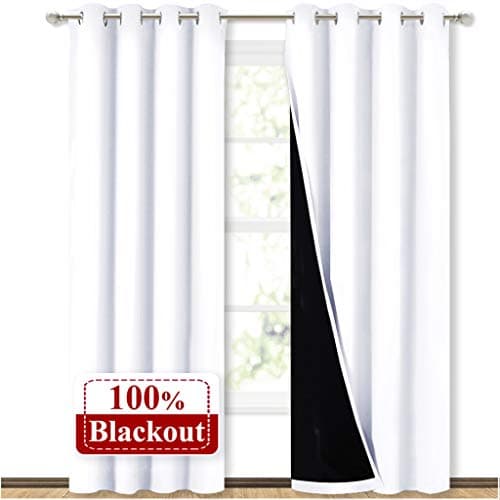 NICETOWN 100% Blackout Window Curtain Panels, Cold and Full Light Blocking Drapes with Black Liner for Nursery, 84 inches Drop Thermal Insulated Draperies (White, 2 Pieces, 52 Wide Each Panel)